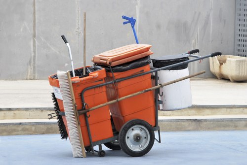 Operatives carrying boxed office waste down a staircase