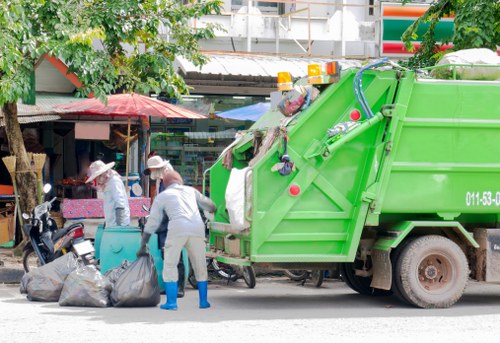 Documentation folder showing insurance and safety certificates for a waste removal firm
